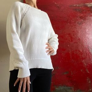 Bright white jcrew chunky sweater with crochet stitching detail.